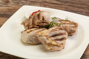 Grilled pork tenderlion with tomato sauce