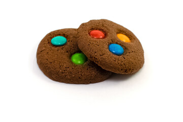Cookies with colorful candy isolated on white.