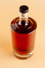 Brandy bottle on a light background
