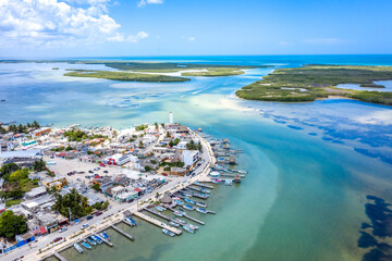 Aerial landscape overlooking the city of Rio Lagartos. The city is surrounded by a beautiful river with azure water. Fishing boats are moored to the shore. Yucatan, Mexico