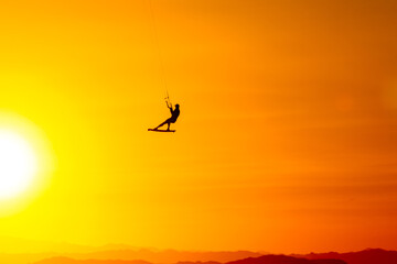 Obraz na płótnie Canvas Sunset kiteboarding