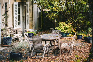 House yard and garden  covered with dry yellow leaves in Luchon town, France