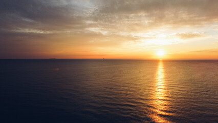 Fototapeta premium Beautiful sunset over sea, aerial view. Evening seascape, drone photography.