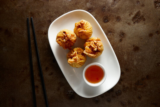 Deep fried dumpling dish on table