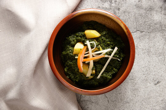 Saag aloo dish on table