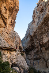 Royal Trail also known as "El Caminito Del Rey". Mountain path along steep cliffs in gorge Chorro, Malaga, Andalusia, Spain