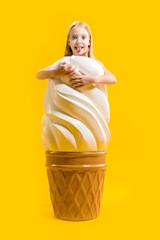 Props, mannequin. Waffle cone. The girl, delighted with the big ice cream, stuck out her tongue....