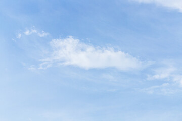 The cloud is large and airy in the blue sky