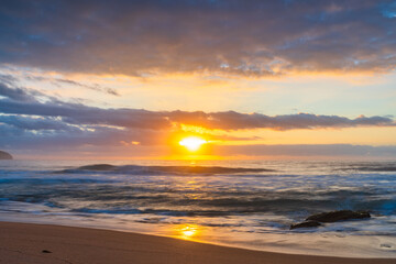 Fototapeta na wymiar Soft sunrise seascape with clouds
