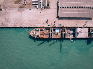 Sea tug for the factory ships in the port to the parking lot, aerial view