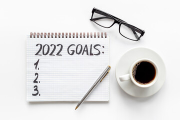 New year goals and resolutions hand writing - inspirational and motivating concept
