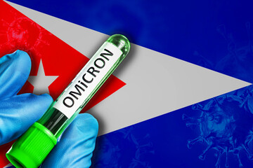 Guyana outbreak of omicron variant. Hand holds a test tube with covid-19 virus omicron in front of...