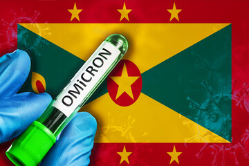 Grenada outbreak of omicron variant. Hand holds a test tube with covid-19 virus omicron in front of...