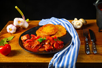 Original Hungarian goulash with potato pancakes