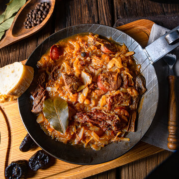 Polish bigos cooked according to an old recipe with wine and plum