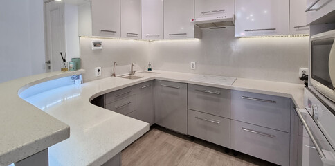 white-gray built-in kitchen furniture. simple solutions for the apartment.