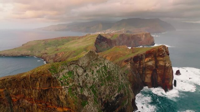 Flying over bizarre brown-green rocks of Ponta de Sao Lourenco, Madeira island, Portugal. Aerial drone shot, 4K