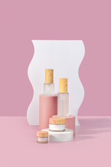 Various blank cosmetic containers on podiums. Pink background for  presentation. Skincare beauty products. Copy space