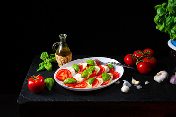Tomato with mozzarella and basil