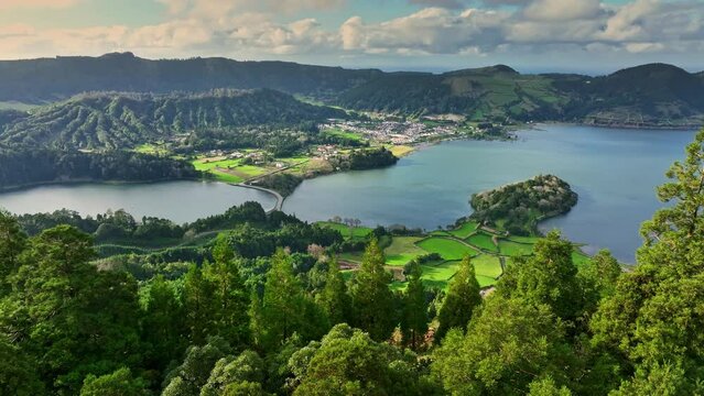 Flying over Lagoa das Sete Cidades lake in sunny day. Sao Miguel Island, Azores, Portugal. Lagoa Azul and lagoa Verde