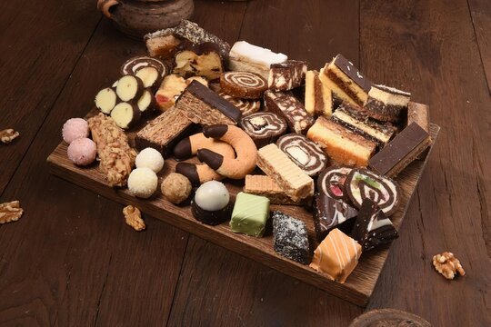 Different Kinds Of Small Cookies On Table