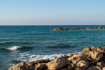 Fototapeta premium Nahariya's Promenade and Galei Galil Beach view of the sea and the shore from the pier