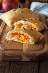 Savory spicy hand pies with pumpkin. Close up.