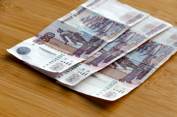 Money with a face value of 500 rubles lying on the table. The concept of finance, investment,
