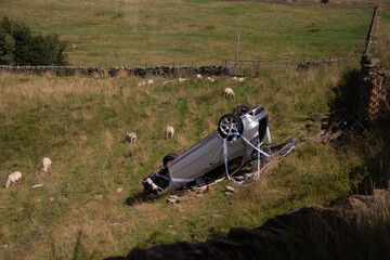 An upturned car in the peak district on a main road between Macclesfield, Cheshure and Buxton,...