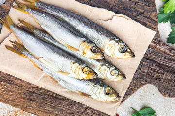 sprat fish herring smoked salted seafood fresh portion dietary healthy meal food dieter still life snack on the table copy space food background rustic top view pescatarian diet