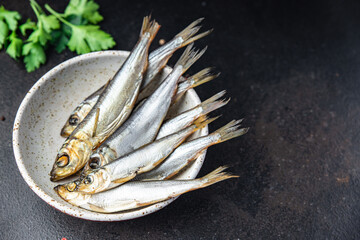 sprat fish herring smoked salted seafood fresh portion dietary healthy meal food dieter still life...