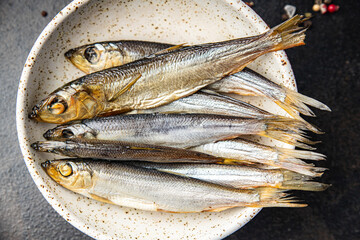 sprat fish herring smoked salted seafood fresh portion dietary healthy meal food dieter still life snack on the table copy space food background rustic top view pescatarian diet