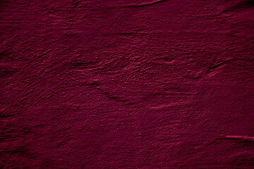 Crimson colored wall background with textures of different shades of crimson red