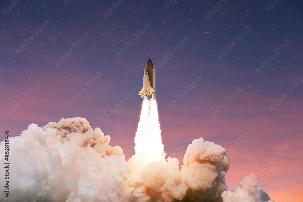 Aufkleber successful launch of a rocket into space at sunset. spaceship takes off up into the pink blue sky. l