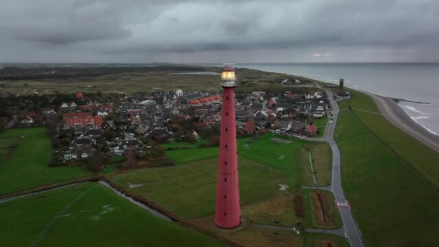 Lighthouse tower Lange Jaap in Den Helder drone aerial footage 5K along the sea near the island of Texel in North Holland, The Netherlands.