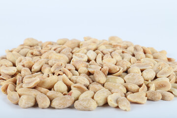 Brown peanuts isolated on white background top view
