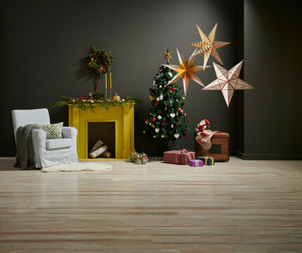 Christmas new year style in the grey room with yellow fireplace, chair gift box and ornament decoration.