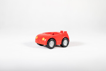 red toy convertible car on white background