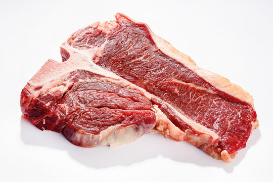 raw t-bone beef steak on a white background
