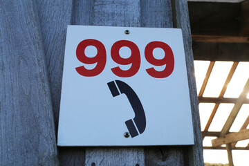 A 999 emergency number and telephone icon to indicate an emergency telephone is nearby.