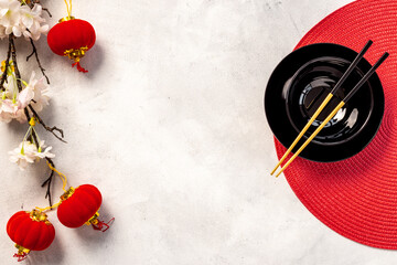 Asian tabble place setting with red bamboo mat for Chinese New Year