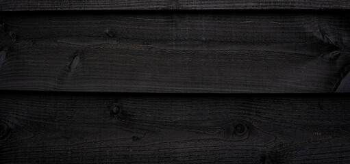 Fototapeta Panoramiczne tło w kolorze czarnym motyw deski, drewno. obraz