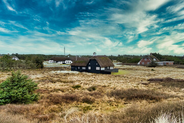 Obraz premium Vacacation houses homes near the North Sea coast in Blaavand, Denmark