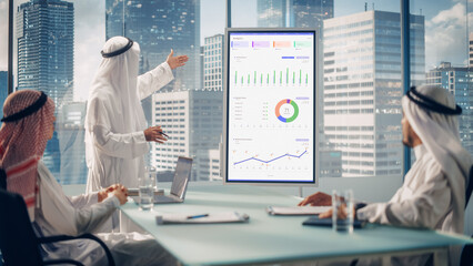 Emirati Businessman Holds Meeting Presentation for a Business Partners. Arab Manager Uses Digital...