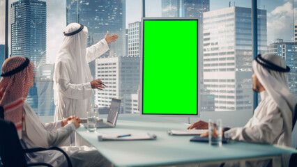 Emirati Businessman Holds Meeting Presentation for Business Partners. Arab Manager Uses Digital...