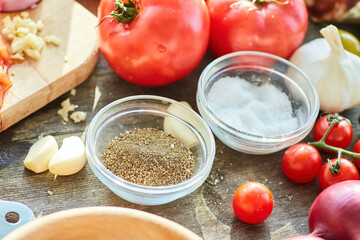 An assortment of spices on the table for cooking. Seasonings for the kitchen