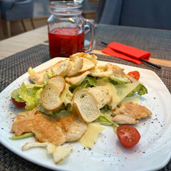 Caesar salad with chicken and raspberry tea 