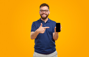 Man pointing at smartphone with black screen