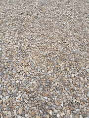 Texture of small pebbles of crushed stone