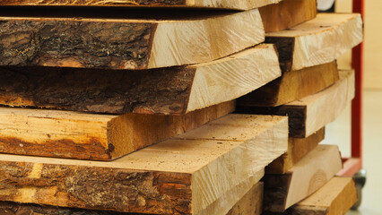 Stack of thick pine wood planks 